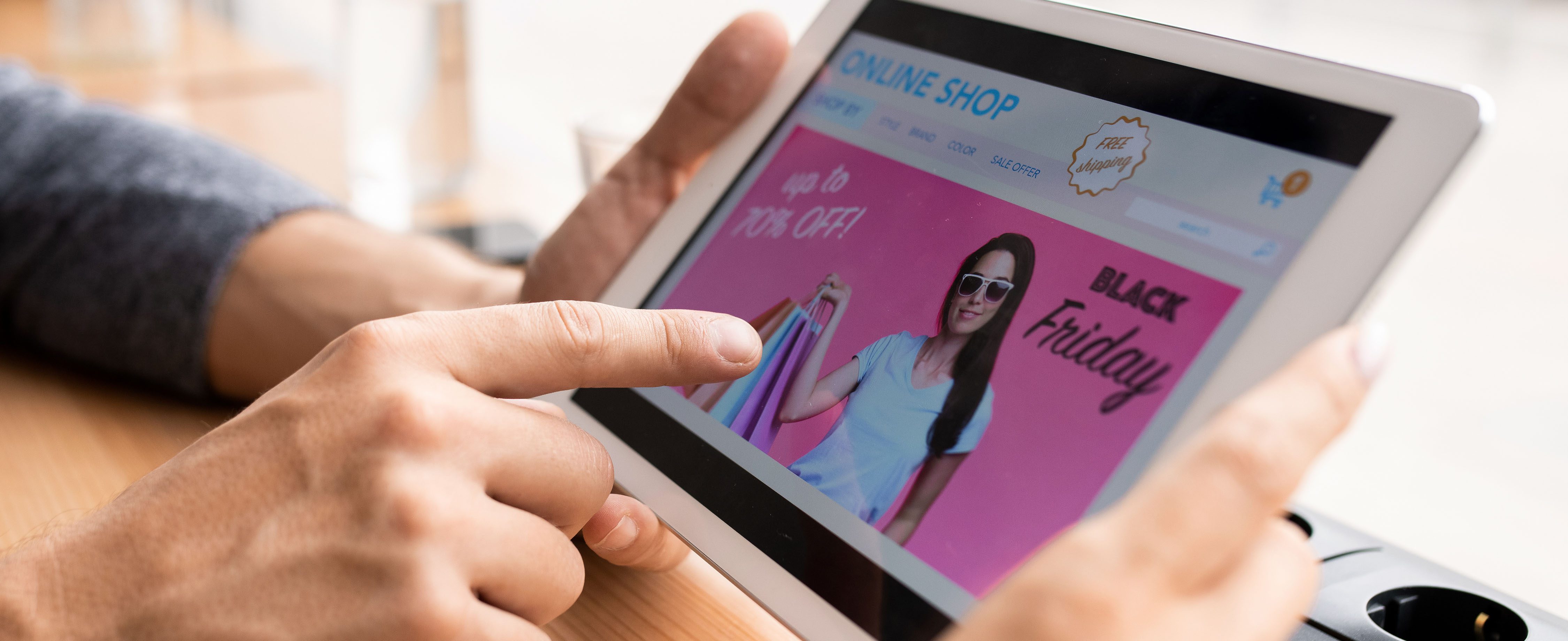 tablet showing black friday sale on tablet for digital marketing faqs