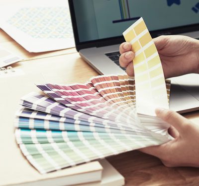 brand-colors-color-book Looking at a color book to pick out brand colors
