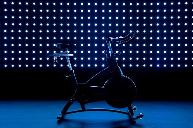 stationary bike with a a black and blue background